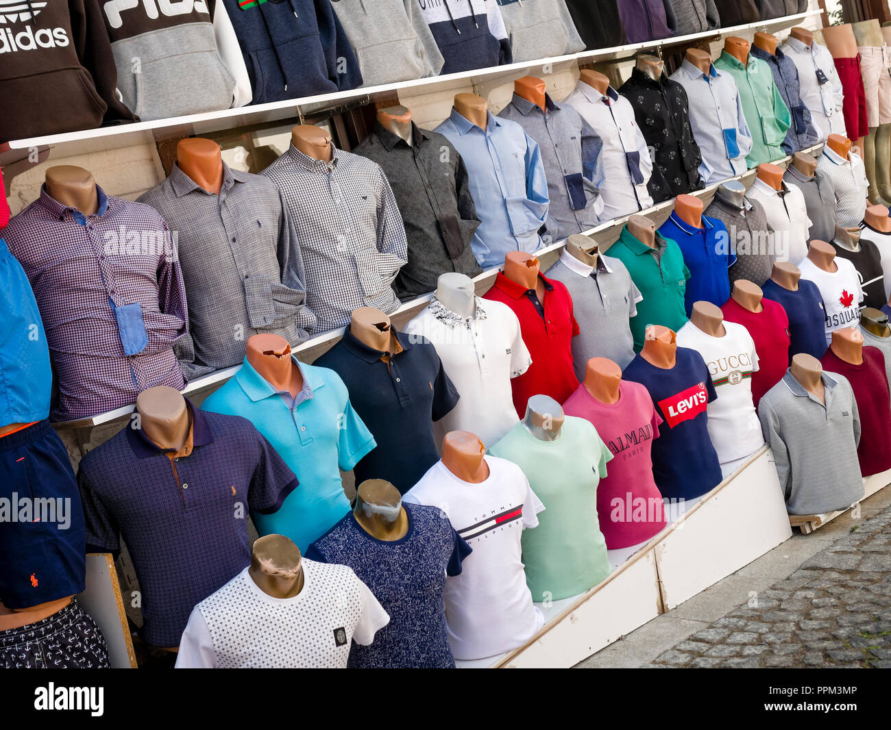 counterfeit-or-fake-designer-clothing-for-sale-outside-shop-in-the-busy-harbour-area-of-kalkan-PPM3MP.jpg