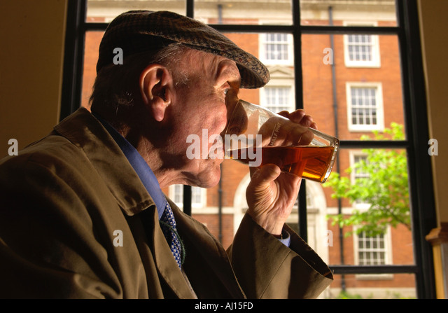 old-man-drinking-pint-of-beer-in-pub-uk-
