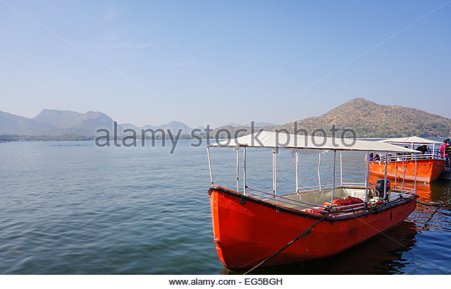 two-red-boats-docked-for-boat-ride-on-fa