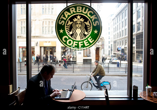 city-worker-on-laptop-in-starbucks-coffe