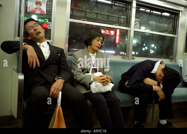 people-sleeping-on-a-commuter-train-in-t