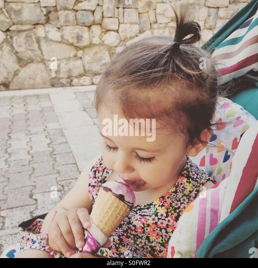 baby-girl-eating-ice-cream-outdoor-s0fwr