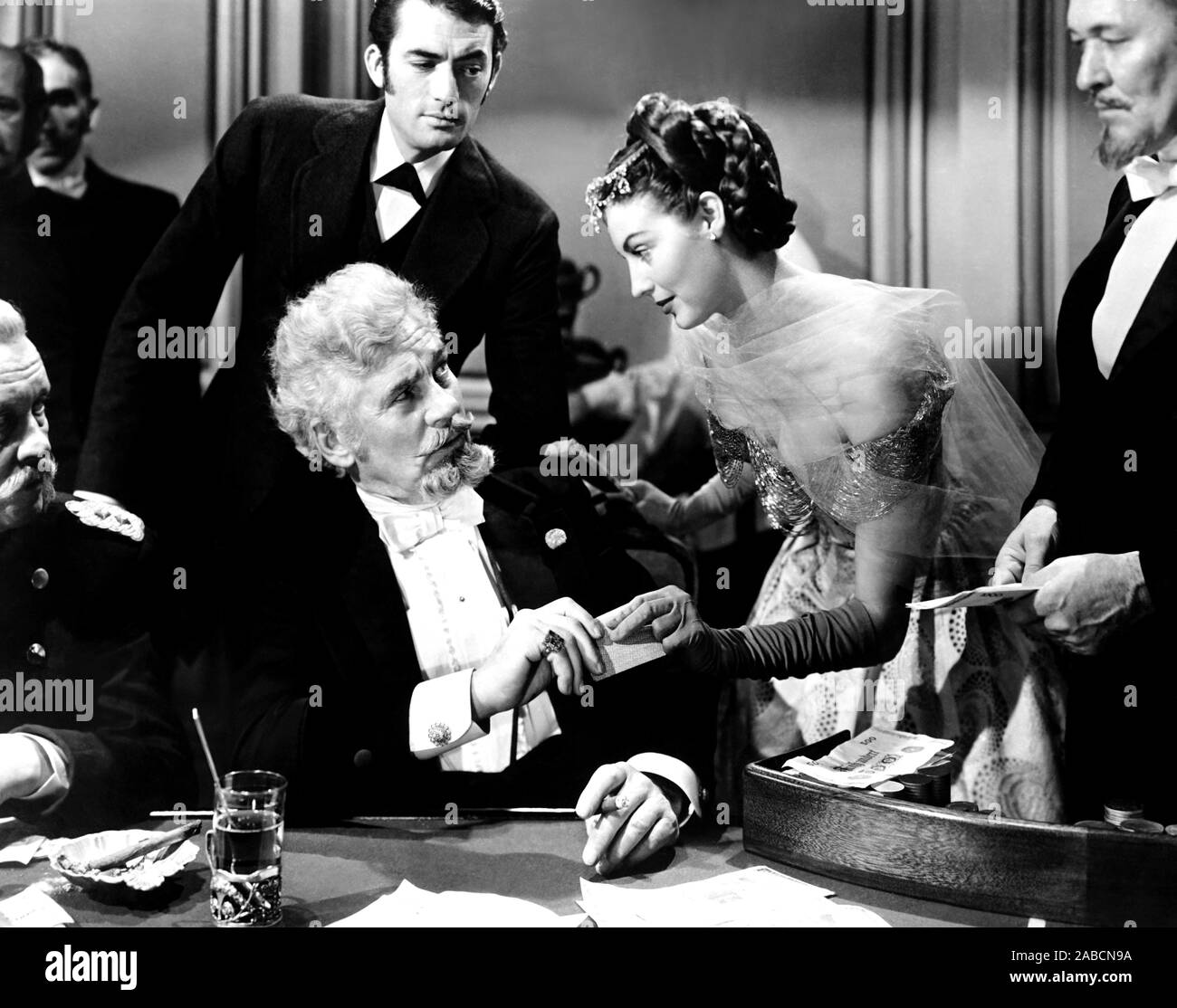 THE GREAT SINNER, from left, Walter Huston, Gregory Peck (background ...
