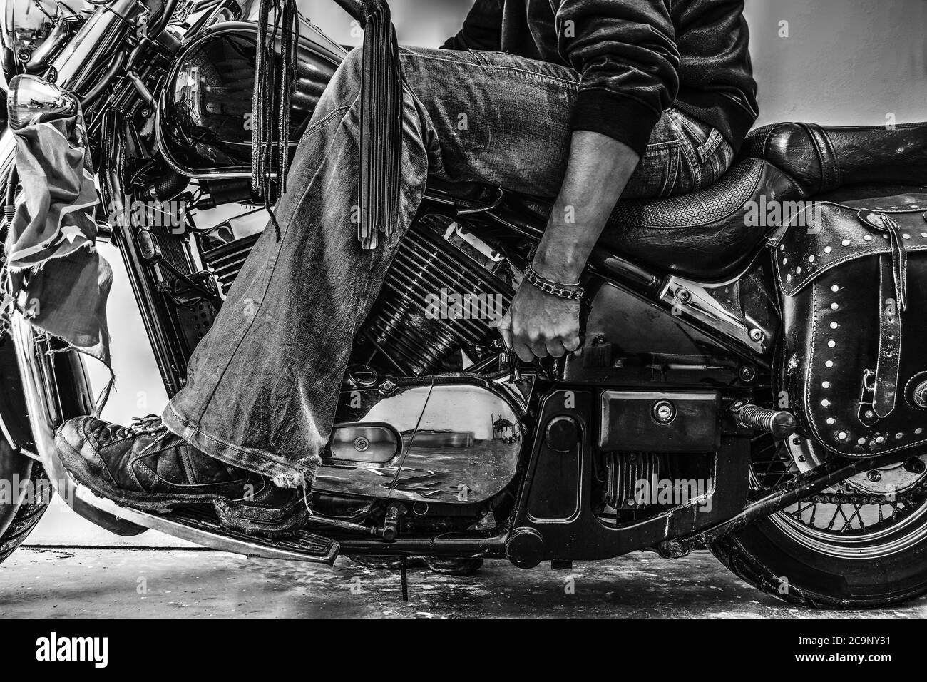 biker starting a classic motorcycle. Black and white effect Stock Photo ...