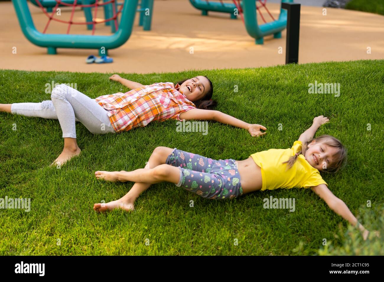 Happy Children Playing Outdoors Children On The Playground Stock Photo