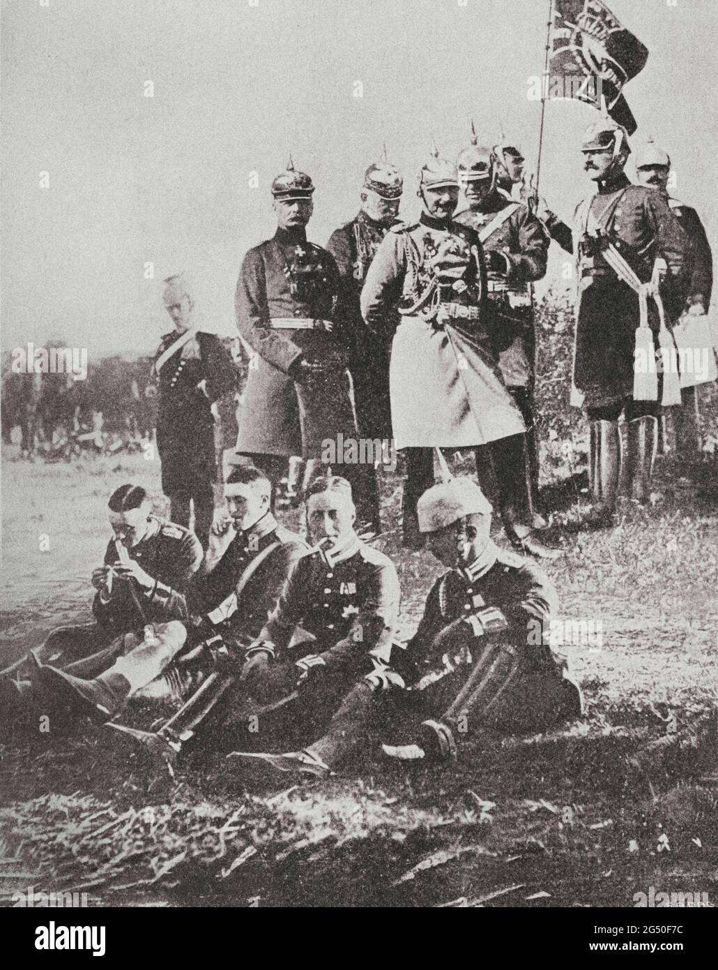 The German kaiser Wilhelm II and his staff. At his feet, his son, the