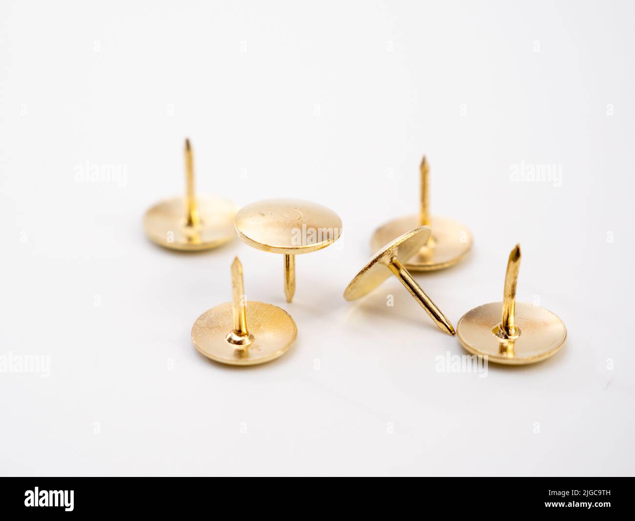 Set of golden thumbtacks. Golden buttons Stock Photo - Alamy