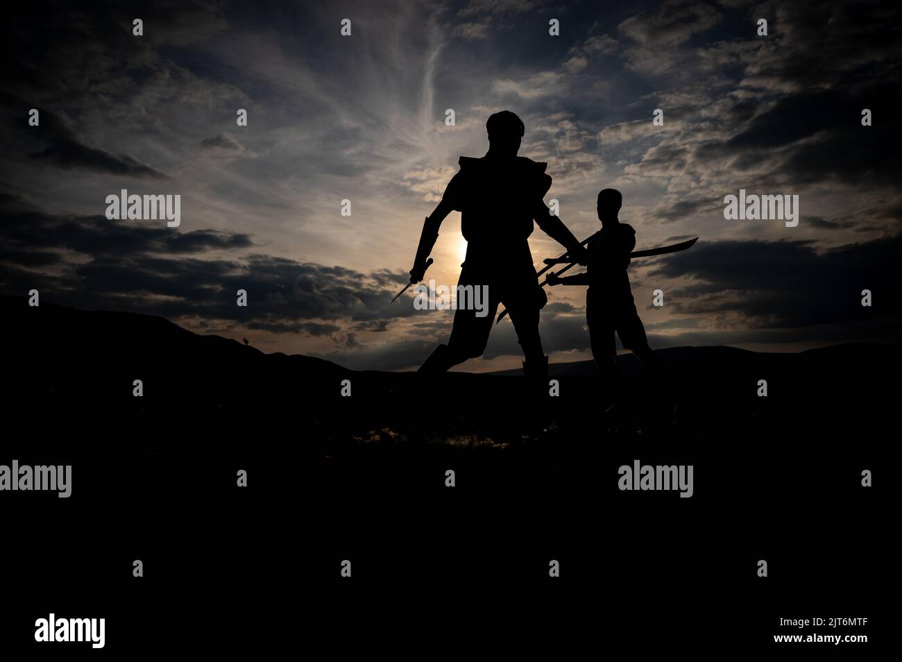 Martial arts sword fighting silhouettes at sunset Stock Photo - Alamy