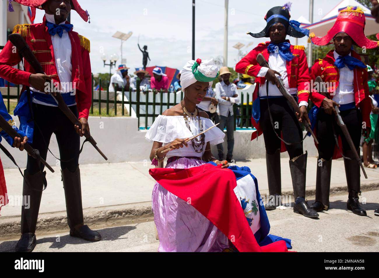 A woman plays the role of Catherine Flon during Flag Day celebrations ...
