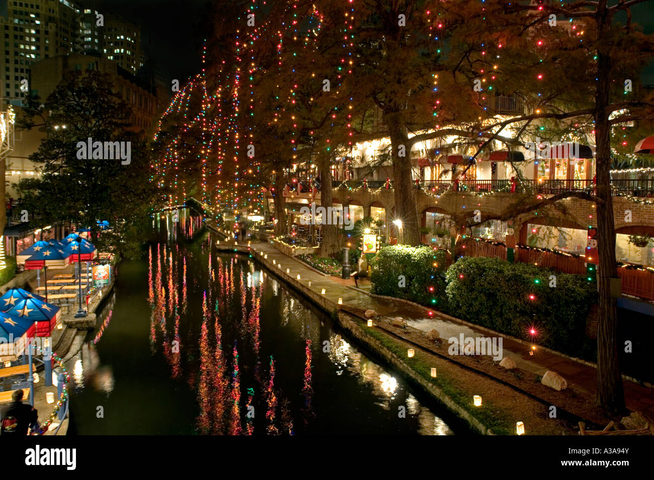 San Antonio Texas river walk at night with Christmas lights reflecting