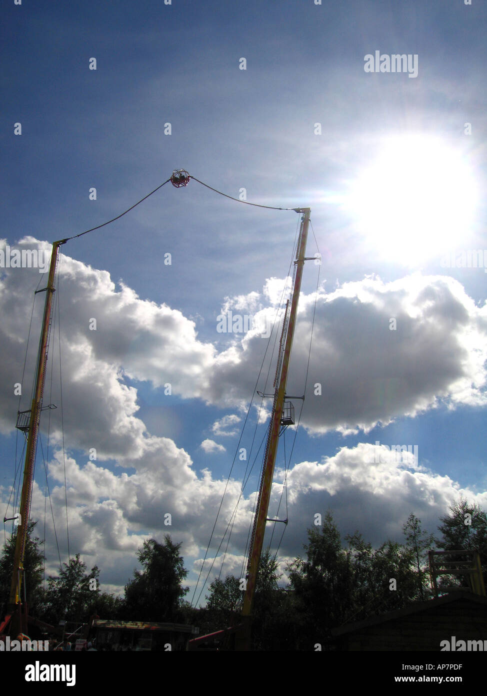 Vertical reverse bungee fairground ride Stock Photo - Alamy