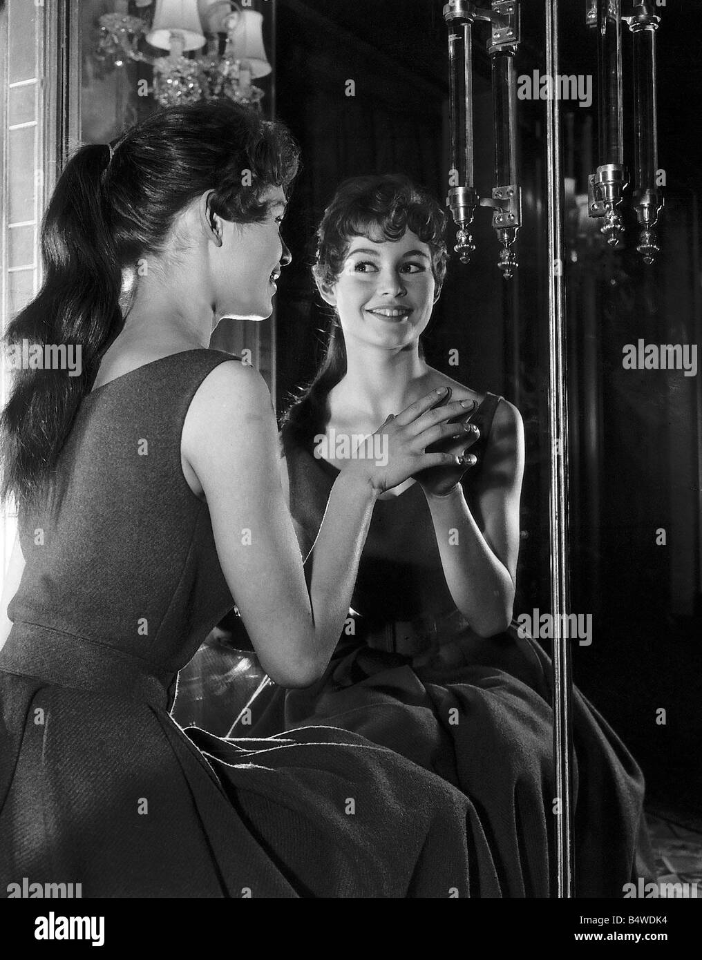 Brigitte Bardot french actress looks in the mirror Stock Photo - Alamy