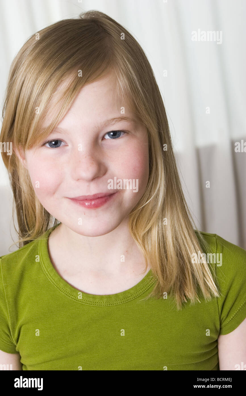 Cute blonde elementary girl child about 7 8 years, look at camera Stock ...