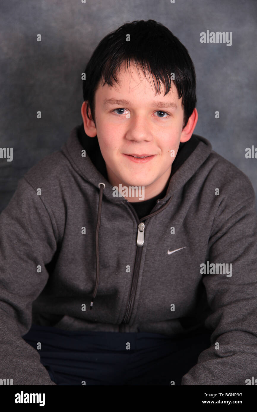 Teen boy looking at camera wearing a hoodie UK Stock Photo - Alamy