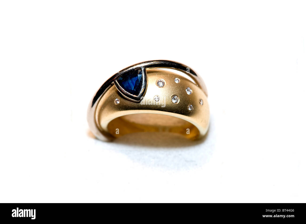 Gold jewelry ring with diamonds and Sapphire Stock Photo - Alamy