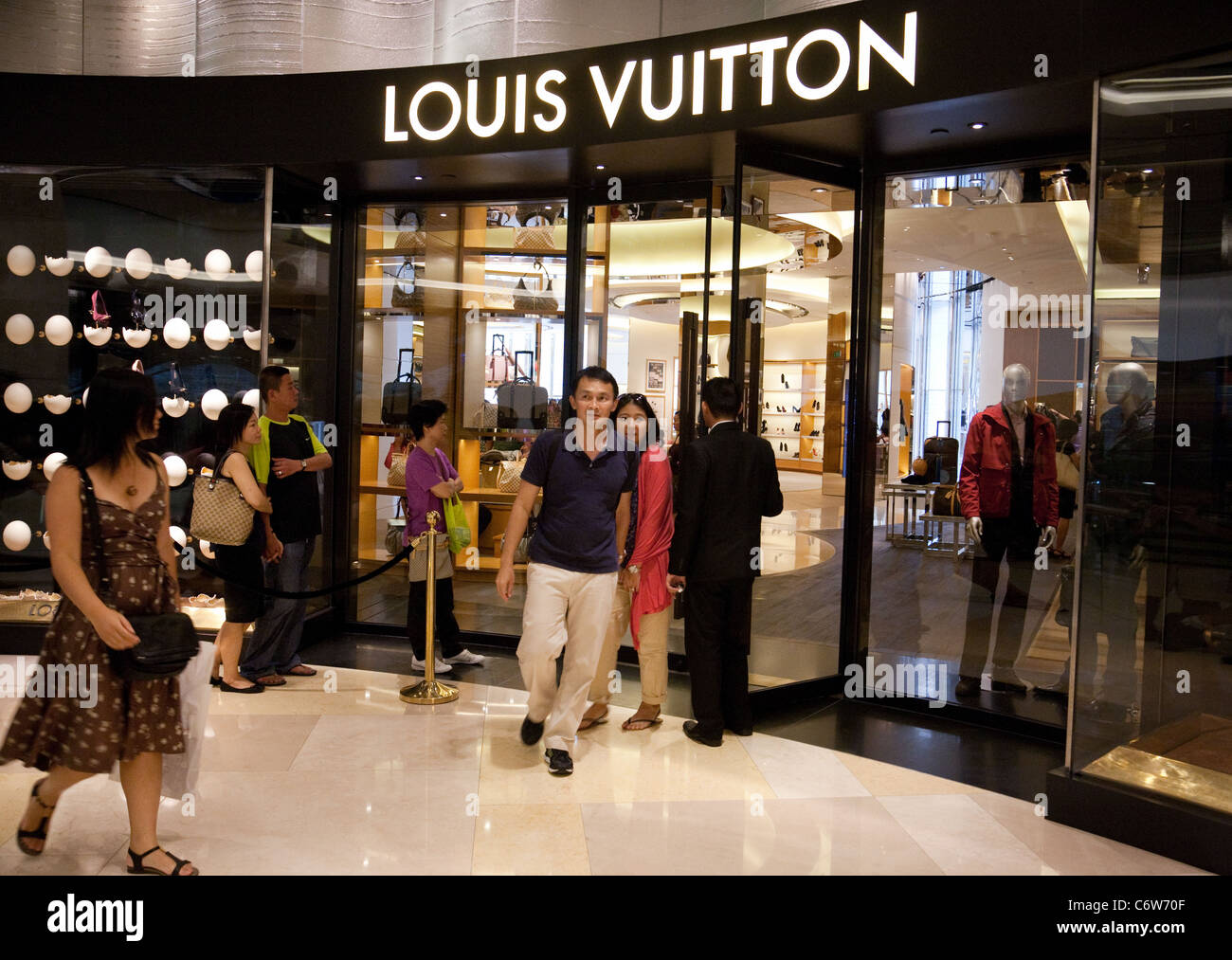 Louis Vuitton Singapore; - Customers at the Louis Vuitton store, Ion ...