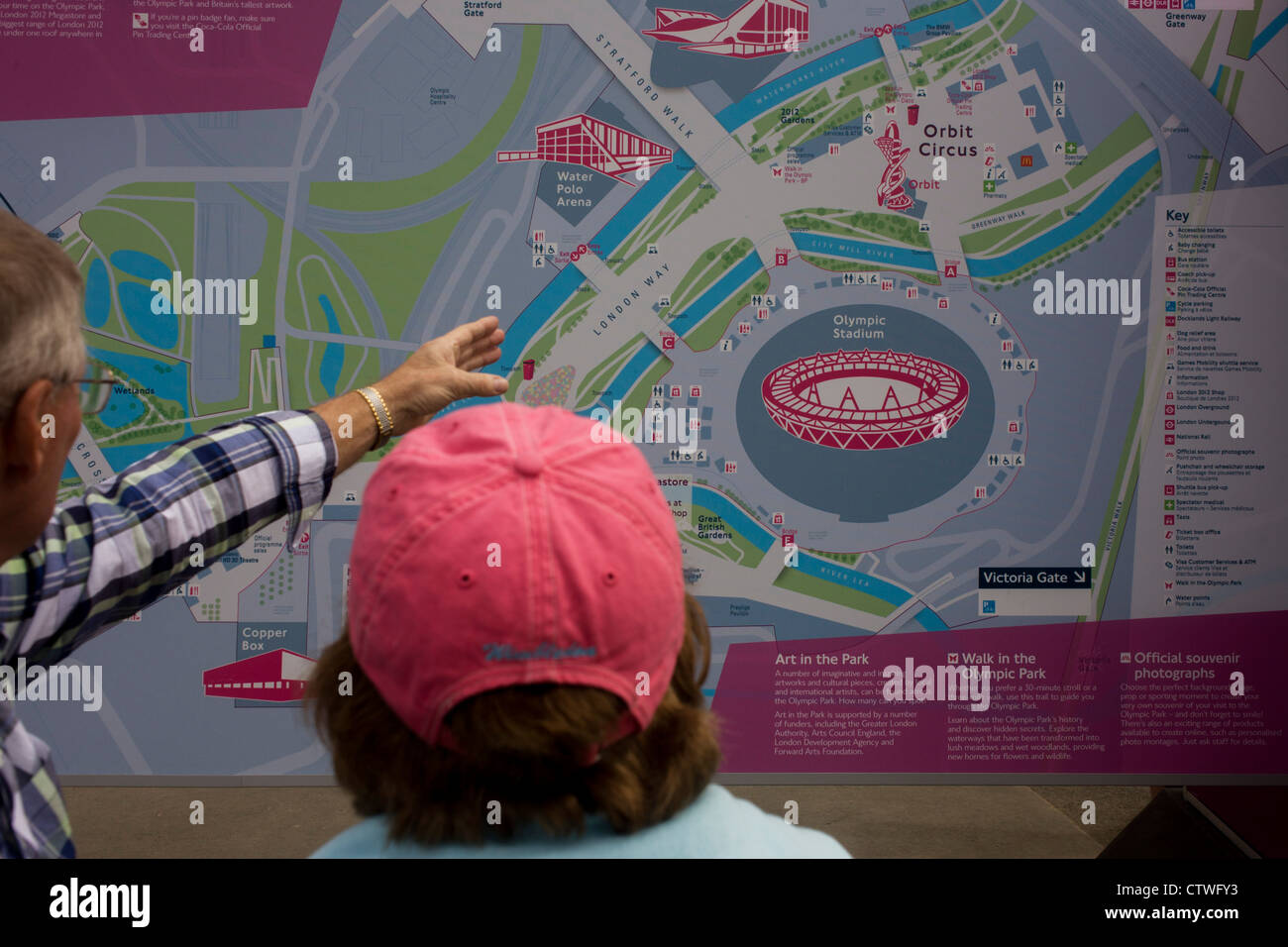 Spectators Consult A Detailed Map Of The Olympic Park During The London CTWFY3 