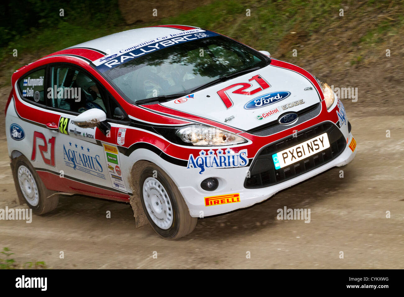 2011 Ford Fiesta R2 With Driver Jussi Kumpumaki On The Rally Stage At