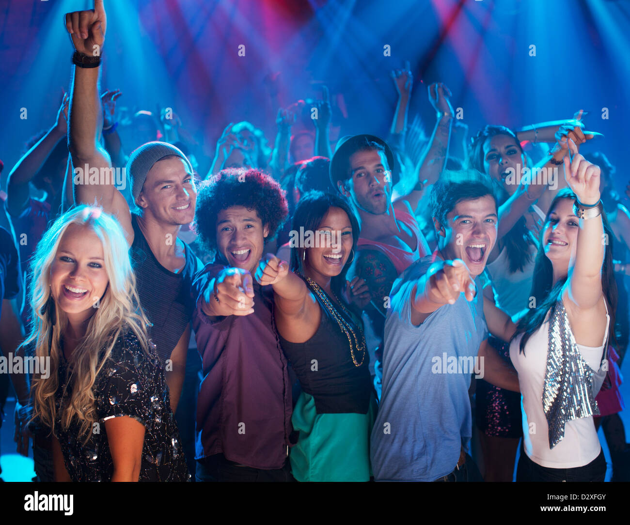 Portrait of enthusiastic crowd on dance floor of nightclub Stock Photo ...