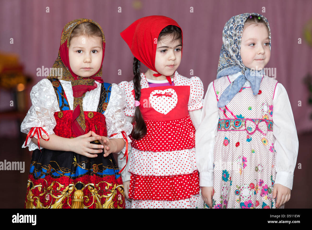 Cute girls in Russian traditional clothes in kindergarten standing on ...