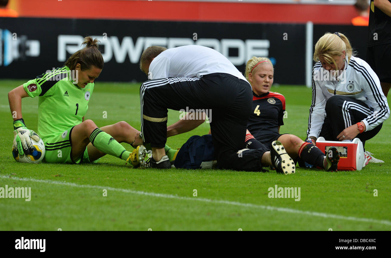 Goalkeeper Nadine Angerer L And Leonie Maier Of Germany Get Medical Treatment During The Uefa 