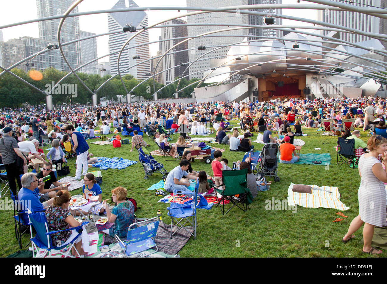 People enjoy an afternoon concert in Millennium park, Chicago, Illinois