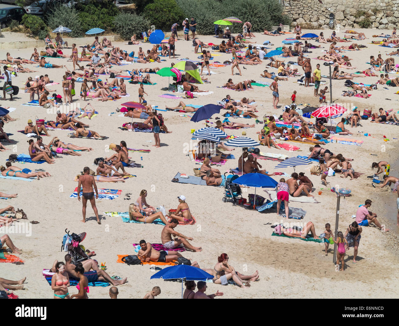 Crowd Of People Sunbathing On The Beach At Antibes Cote D Azur