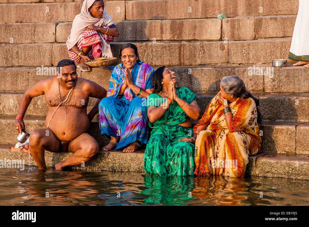 Hindu Pilgrims Praying And Bathing In The Holy River Ganges Varanasi Uttar Pradesh India