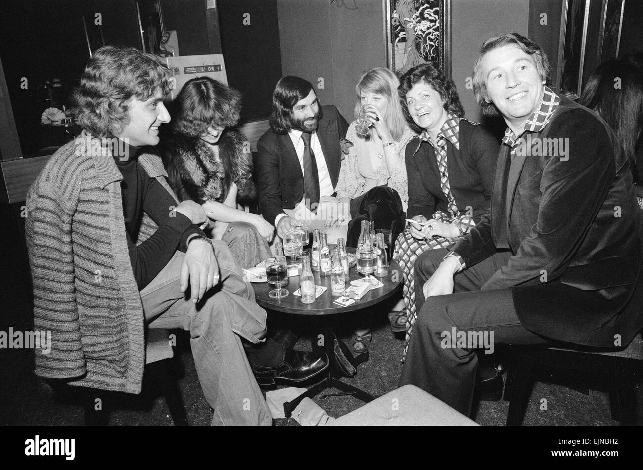 Footballer George Best with friends at his night club Slack Alice in ...