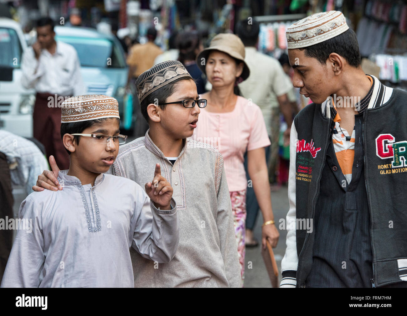 Moslem boys walking in Yangon, Myanmar Stock Photo - Alamy