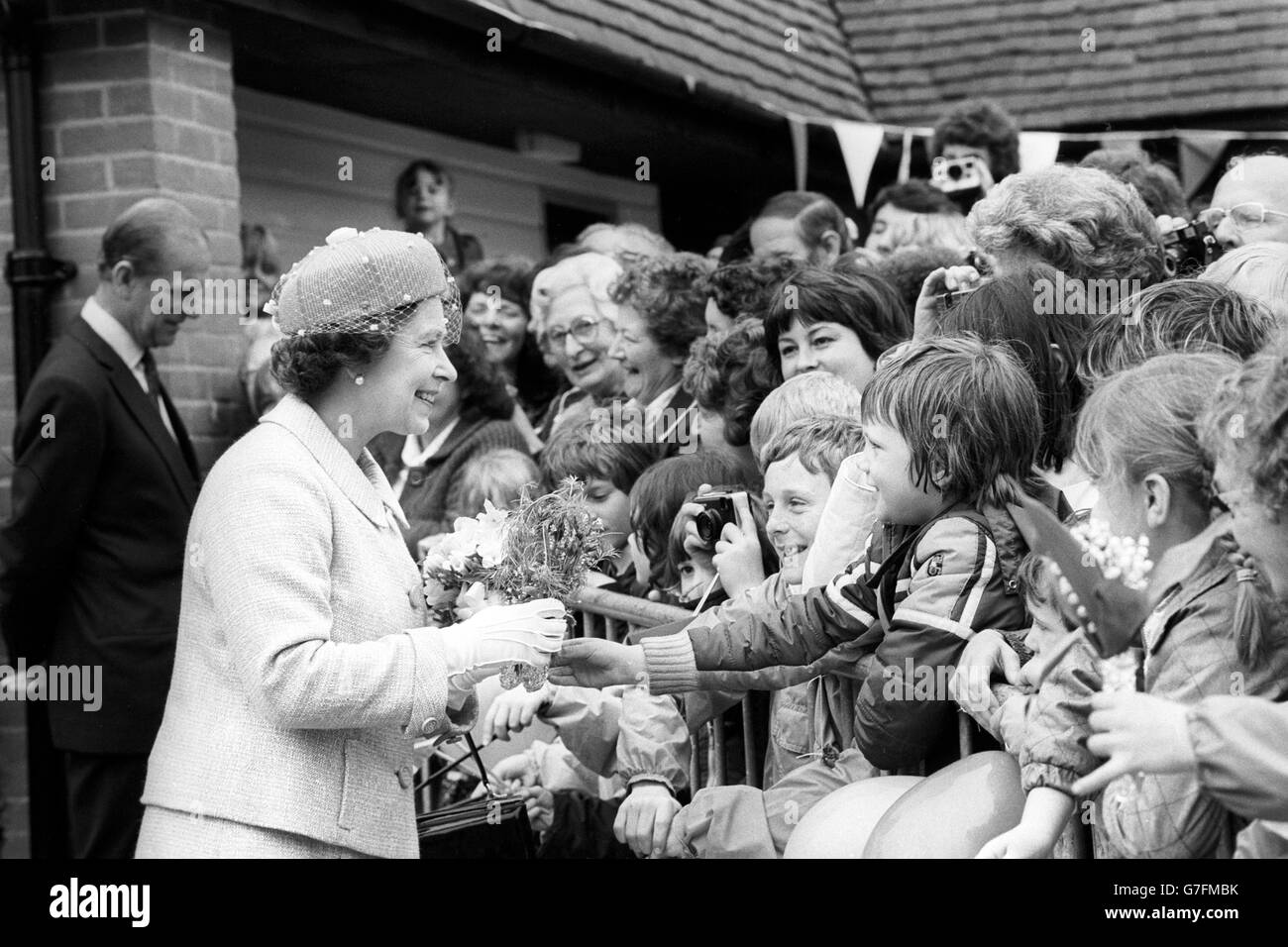 Queen Elizabeth II greets the crowd during her visit to South Woodham ...