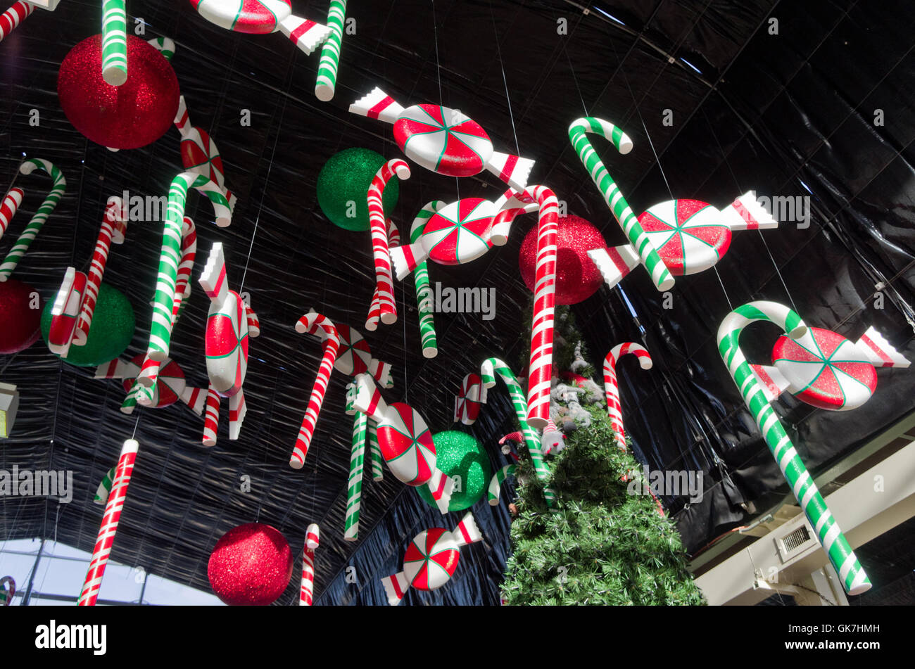 Colourful Christmas decorations suspended from the ceiling, part of a