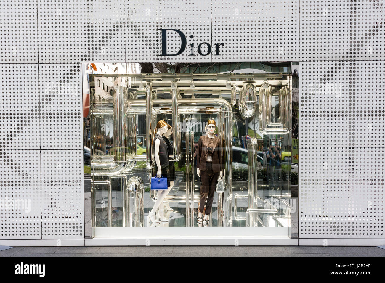 Japan, Osaka, Shinsaibashi. Dior fashion store shop window with dress ...