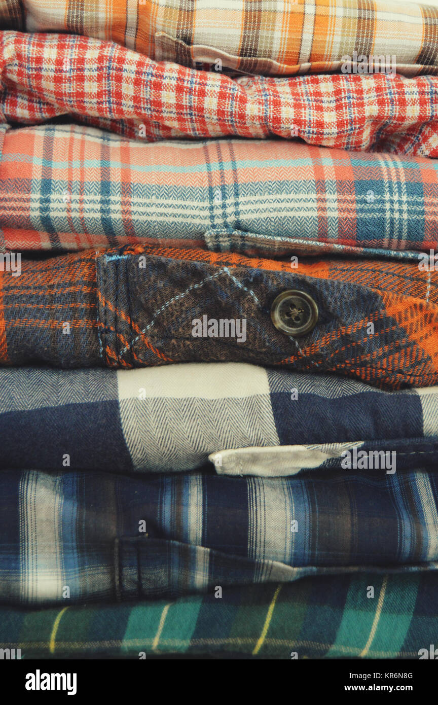Folded plaid shirts, flannel shirts Stock Photo - Alamy