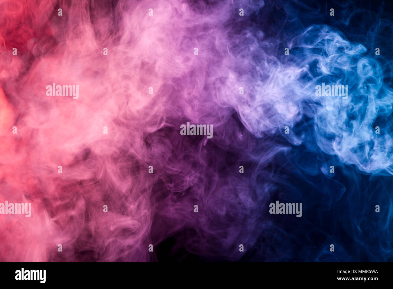 Colorful pink, blue smoke on a black isolated background. Background ...
