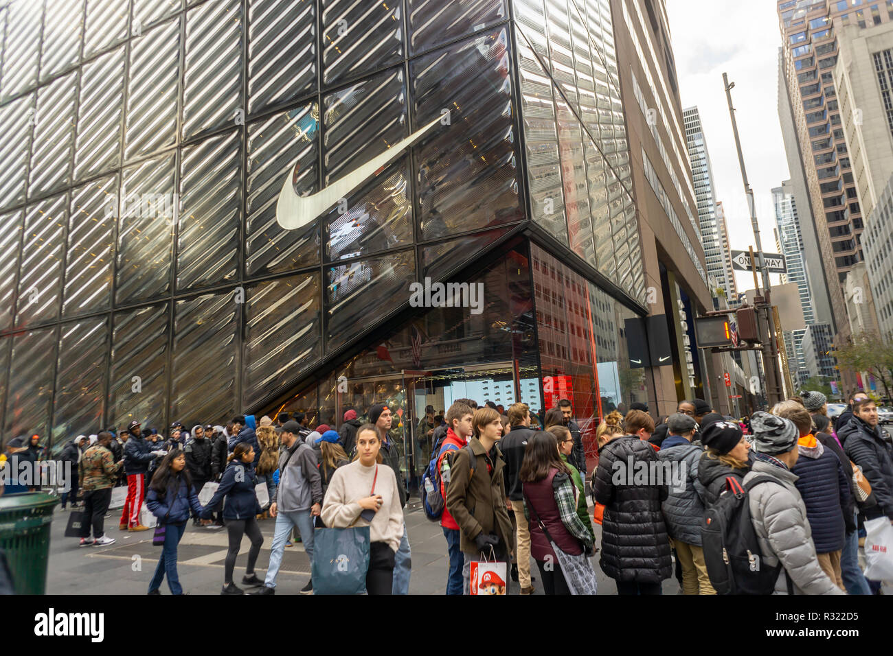 Shoppers and visitors outside the newly opened Nike flagship store on ...