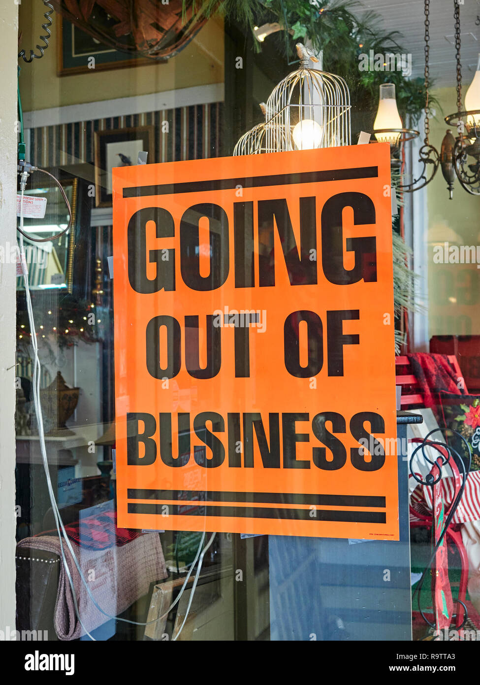 Going Out of Business sign in the window of a small store or storefront