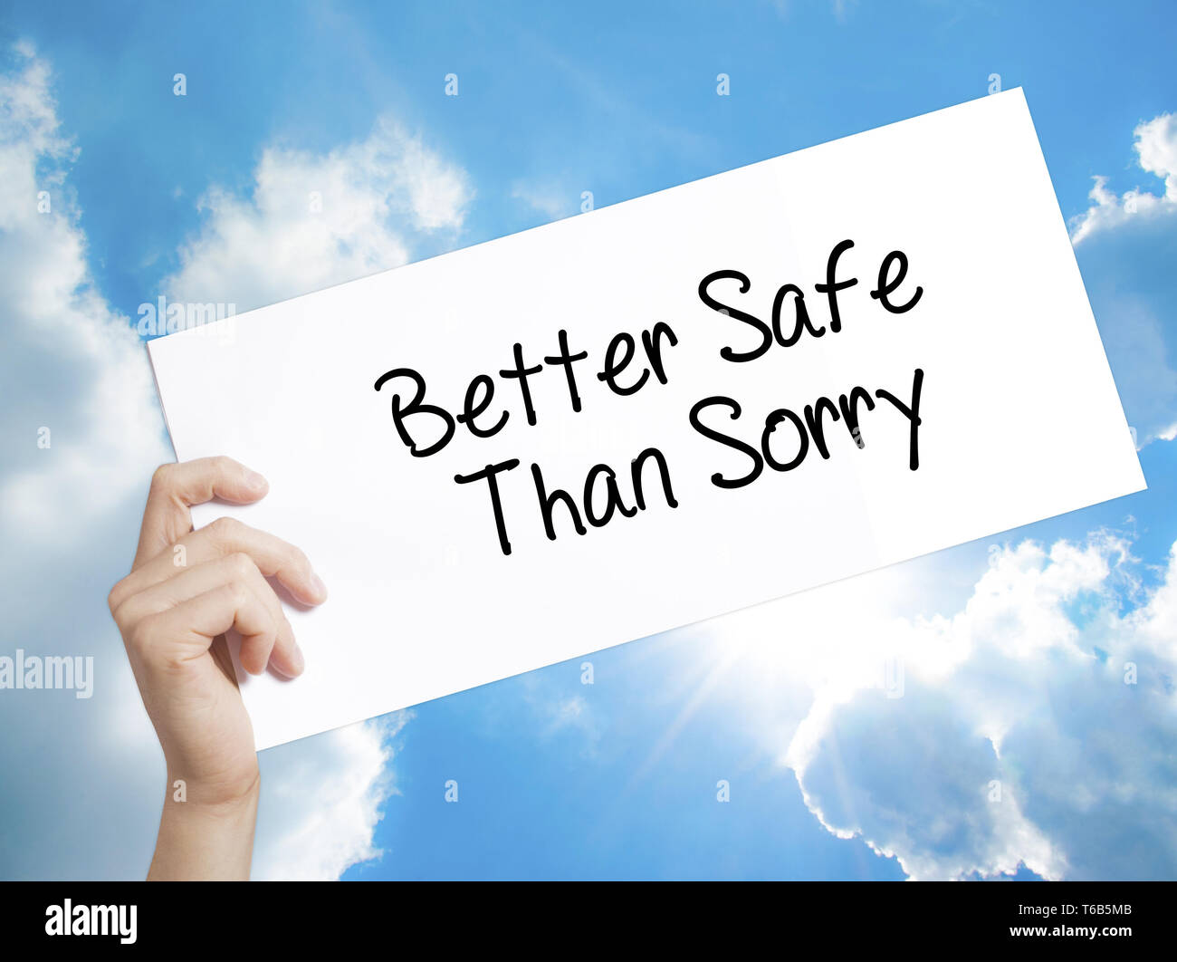 Better Safe Than Sorry Sign On White Paper Man Hand Holding Paper With