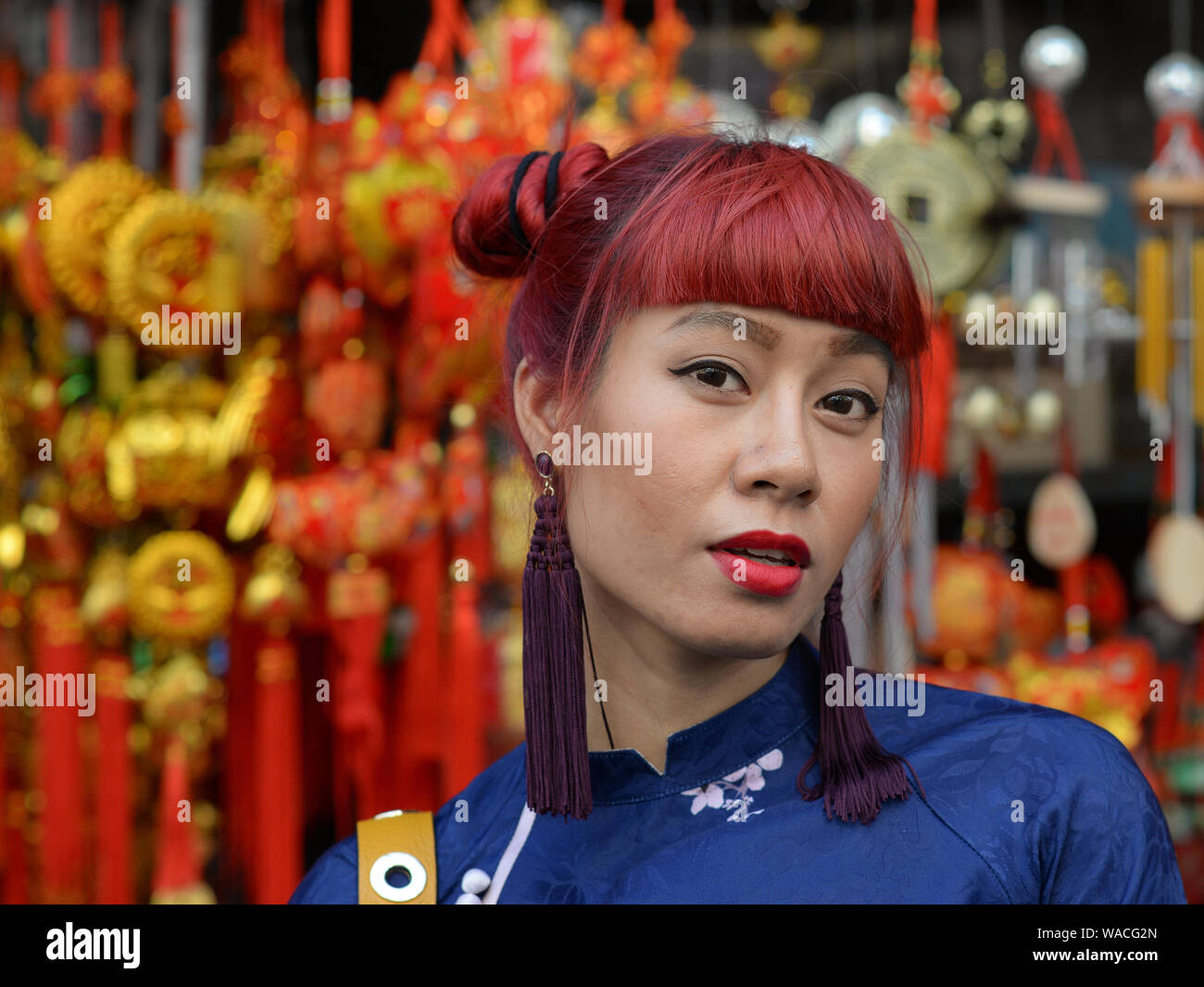 Young Thai third-gender beauty (kathoey) poses for the camera in front ...