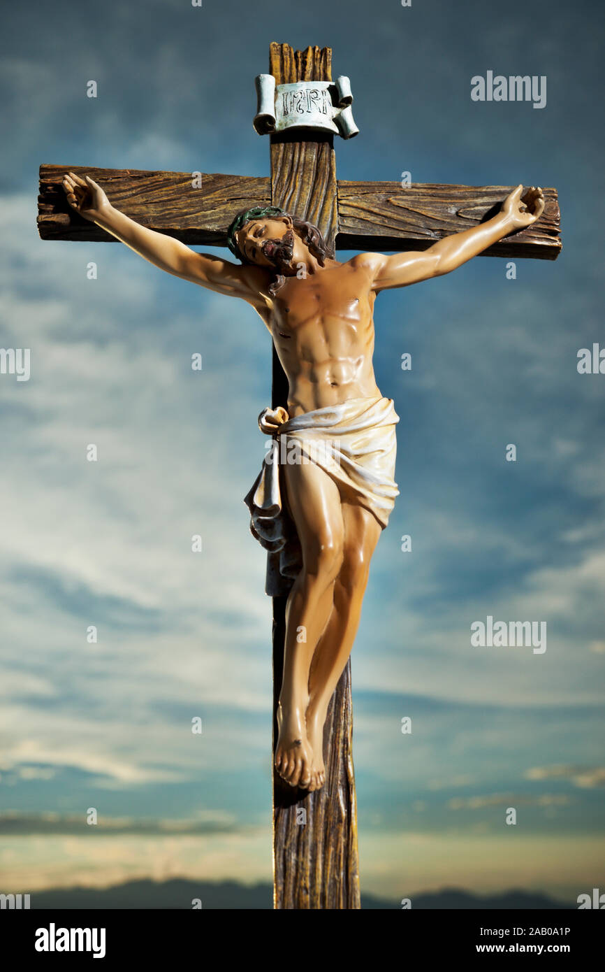 A Small Statue Of Jesus Christ On The Cross Stock Photo Alamy