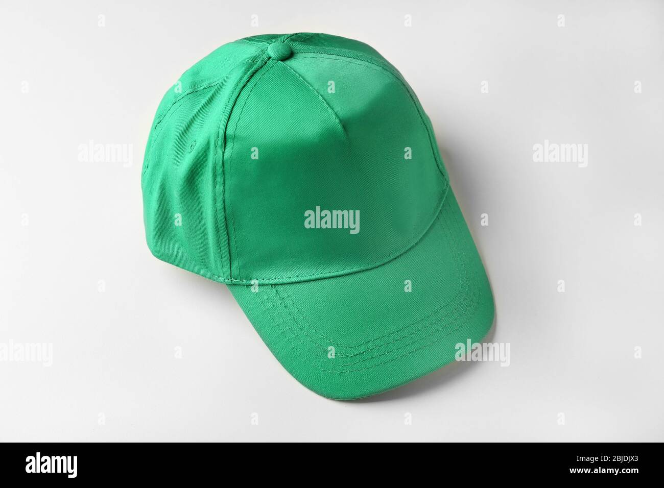 Blank green baseball cap on white background Stock Photo - Alamy