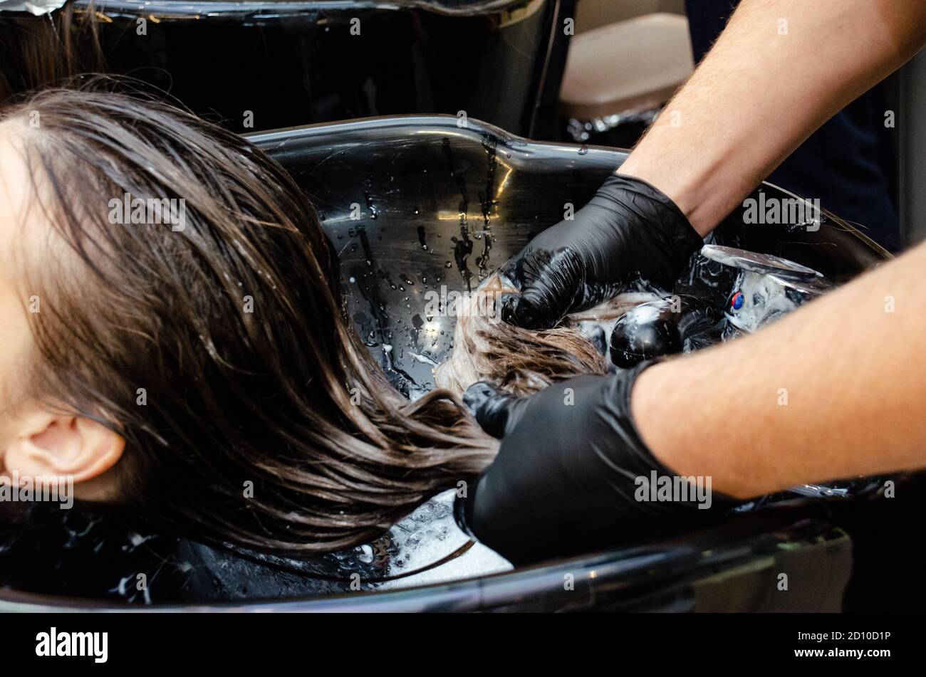 Washing hair in hair salon Stock Photo - Alamy