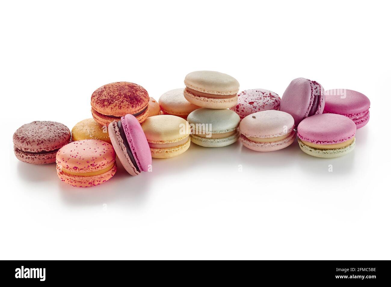 Pile of colorful French macarons on white background Stock Photo - Alamy