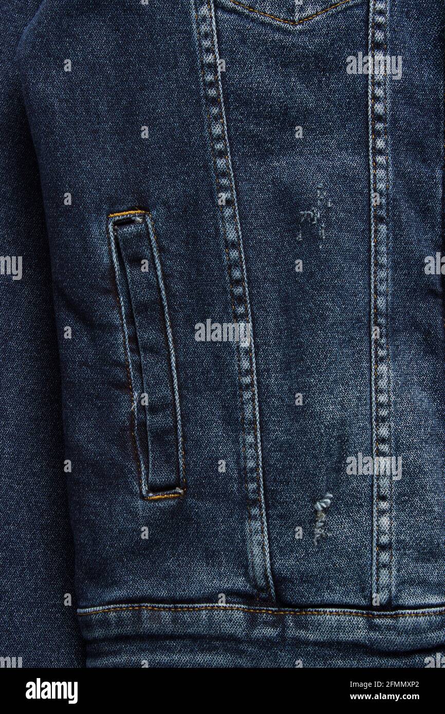 Close-up denim jacket pocket. Denim jacket background. Blue jeans ...