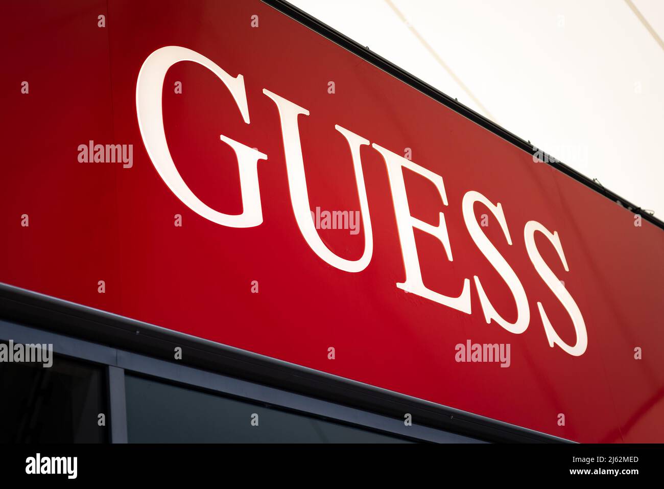 Guess retail clothes shop sign at Ashford Outlet Center, Kent, England ...
