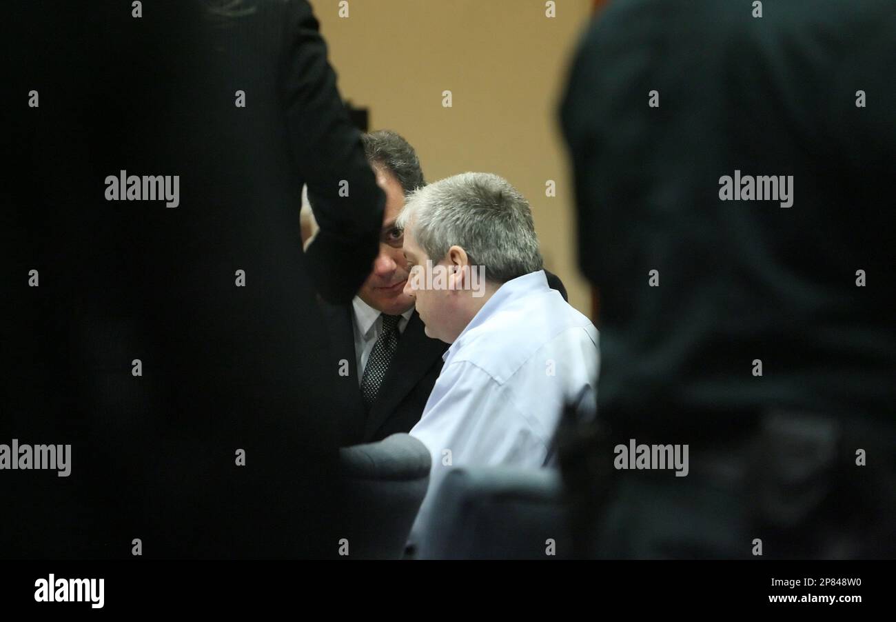Defense attorney Jerry Meisner, left, talks with Michael King as the ...