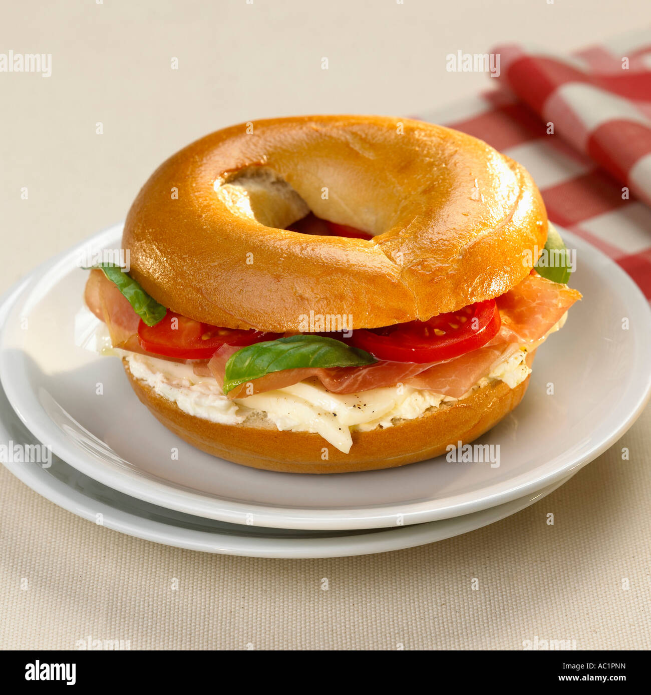 Bagel with tomato and mozzarella Stock Photo - Alamy
