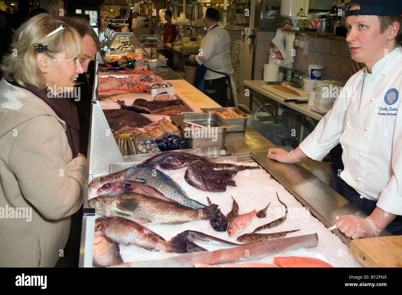 Couple buys fish at Gothenburg s famous fish market Fiskekörkan ...