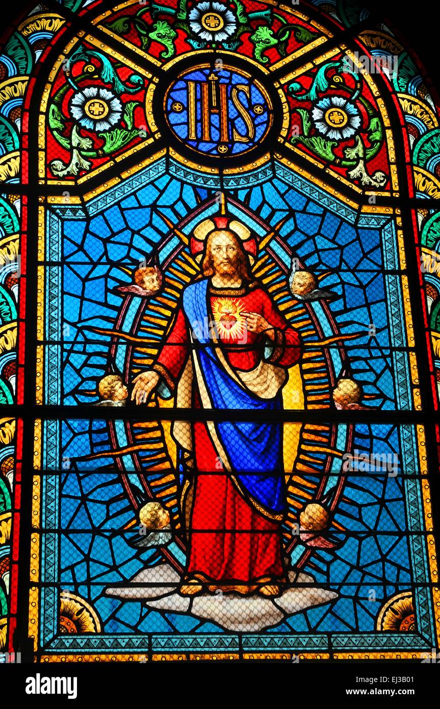 Stained glass window depicting Sacred Heart of Jesus in medieval church ...