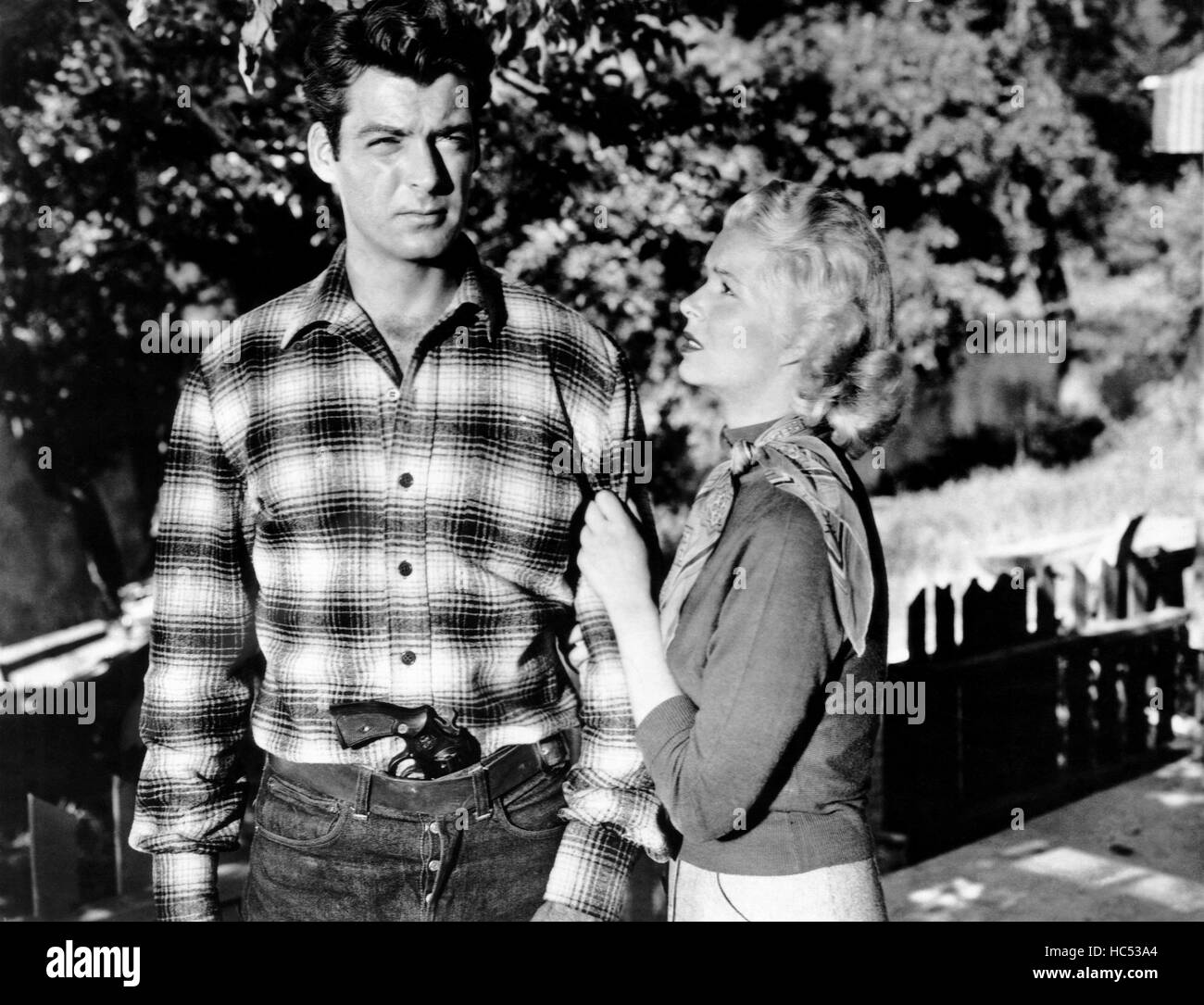 ROGUE RIVER, from left, Rory Calhoun, Ellye Marshall, 1951 Stock Photo ...